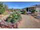 Expansive backyard featuring an outdoor living area, mature trees and lush landscaping at 4680 Suntree Ct, Pahrump, NV 89061