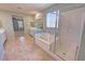 Bathroom featuring tile floors, a shower, a soaking tub, and double sinks at 4680 Suntree Ct, Pahrump, NV 89061