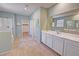Bathroom featuring tile flooring, shower, large mirrors, and walk-in closet at 4680 Suntree Ct, Pahrump, NV 89061