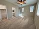 Neutral bedroom with ceiling fan, carpet, and natural light at 4680 Suntree Ct, Pahrump, NV 89061