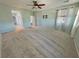 Spacious bedroom with light walls and carpet plus a mounted television at 4680 Suntree Ct, Pahrump, NV 89061
