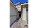 Charming covered entry features brick pavers and a welcoming front door with seasonal wreath at 4680 Suntree Ct, Pahrump, NV 89061