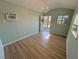 Interior view showcasing natural light from the open door, highlighting the wood floors at 4680 Suntree Ct, Pahrump, NV 89061