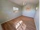 Inviting interior showcasing wood floors and a chandelier, enhanced by natural light at 4680 Suntree Ct, Pahrump, NV 89061