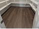 Walk-in pantry with white shelving and durable, wood-style flooring at 4680 Suntree Ct, Pahrump, NV 89061