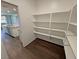 Pantry with white shelving provides ample storage next to the kitchen at 4680 Suntree Ct, Pahrump, NV 89061