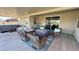 Inviting covered patio with wicker furniture, a hot tub, and a relaxing seating area at 4680 Suntree Ct, Pahrump, NV 89061