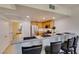 Kitchen with breakfast bar and view to bathroom at 50 Aura De Blanco St # 19203, Henderson, NV 89074