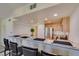 Bright eat-in kitchen boasts stainless appliances and raised breakfast bar at 50 Aura De Blanco St # 19203, Henderson, NV 89074