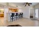 A modern kitchen featuring stainless steel appliances and a breakfast bar with seating for a casual dining experience at 50 Aura De Blanco St # 19203, Henderson, NV 89074