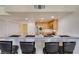 View of kitchen, breakfast bar, and stainless refrigerator at 50 Aura De Blanco St # 19203, Henderson, NV 89074