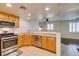 Kitchen with breakfast bar and view of the living room at 50 Aura De Blanco St # 19203, Henderson, NV 89074