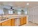 Kitchen with stainless dishwasher and view to living area at 50 Aura De Blanco St # 19203, Henderson, NV 89074
