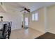 The living area features neutral walls, white window coverings and bar stool seating at the kitchen counter at 50 Aura De Blanco St # 19203, Henderson, NV 89074