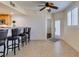 The living space features a seamless flow to the kitchen and outdoor patio, complete with stylish bar stool seating at 50 Aura De Blanco St # 19203, Henderson, NV 89074