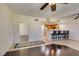 The living room features hardwood floors, a ceiling fan, and an open-concept design, perfect for entertaining at 50 Aura De Blanco St # 19203, Henderson, NV 89074