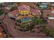 Majestic aerial view of custom home featuring luxurious pool, manicured landscaping, and circular driveway at 503 Aaron Way, Boulder City, NV 89005