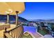 Stunning balcony view overlooking a sparkling pool and picturesque mountain scenery at 503 Aaron Way, Boulder City, NV 89005