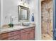 Elegant bathroom features granite counters, vessel sink and tiled shower at 503 Aaron Way, Boulder City, NV 89005