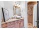 Charming bathroom with unique vessel sink, granite countertops, and tiled shower at 503 Aaron Way, Boulder City, NV 89005