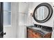 Stylish powder room with ornate vanity, dark marble countertops, and designer fixtures at 503 Aaron Way, Boulder City, NV 89005