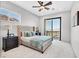 Light bedroom featuring a king bed, balcony access, and scenic mountain views at 503 Aaron Way, Boulder City, NV 89005