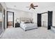 Bright bedroom with carpet, ceiling fan, and ensuite bathroom at 503 Aaron Way, Boulder City, NV 89005
