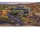 Beautiful home with an infinity pool and luxurious terraced landscaping and retaining walls on a hillside at 503 Aaron Way, Boulder City, NV 89005
