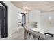Bright hallway with curved stone railing and a chandelier at 503 Aaron Way, Boulder City, NV 89005