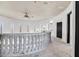 Spacious hallway with curved stone railing, high ceilings, and natural light at 503 Aaron Way, Boulder City, NV 89005