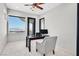 Bright home office with mountain views, a modern chair, and a sleek desk at 503 Aaron Way, Boulder City, NV 89005