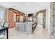 Open-concept kitchen featuring an oversized island, stone accents, and stainless steel appliances at 503 Aaron Way, Boulder City, NV 89005