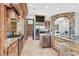Gourmet kitchen with granite countertops, custom wood cabinetry, and stainless steel appliances at 503 Aaron Way, Boulder City, NV 89005