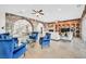 Bright living room featuring stone archways, a fireplace, built-ins, travertine floors and elegant furnishings at 503 Aaron Way, Boulder City, NV 89005