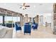 Spacious living area with stone accents, large windows, travertine floors, and open access to dining and lounge spaces at 503 Aaron Way, Boulder City, NV 89005