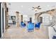 Open living room boasts stone columns, archways, travertine floors and access to a dining area and patio at 503 Aaron Way, Boulder City, NV 89005