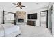 Spacious main bedroom boasts stone fireplace, ceiling fan, and plush carpet at 503 Aaron Way, Boulder City, NV 89005