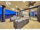 Outdoor living area with bedroom access, mountain views, and comfortable seating for relaxation and entertainment at 503 Aaron Way, Boulder City, NV 89005