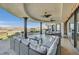 Covered patio featuring columns, mountain views, ceiling fans and outdoor seating at 503 Aaron Way, Boulder City, NV 89005