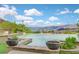 Beautiful pool area with mature landscaping and a breathtaking view of mountains and lake at 503 Aaron Way, Boulder City, NV 89005
