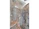 Luxurious shower featuring stunning marble tile, multiple shower heads, and a built-in bench at 503 Aaron Way, Boulder City, NV 89005