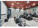 Home theater room with tiered seating, projector screen, and plush leather recliners at 503 Aaron Way, Boulder City, NV 89005