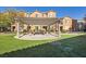 Lush outdoor community space featuring covered seating and manicured landscaping at 5179 Silica Chalk Ave, Las Vegas, NV 89115