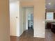 Inviting entryway featuring hardwood floors and views into the kitchen and other rooms at 5179 Silica Chalk Ave, Las Vegas, NV 89115