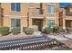 Inviting home exterior with neat landscaping, small bushes, stone accents, and shaded walkway to front door at 5179 Silica Chalk Ave, Las Vegas, NV 89115