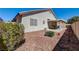 Outdoor patio area surrounded by desert rock and manicured foliage at 5419 Sharpei Ct, Las Vegas, NV 89131