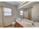 Bathroom featuring a double vanity with lots of counter space, a tub, and a shower combo at 5419 Sharpei Ct, Las Vegas, NV 89131