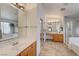 Well-lit bathroom showcases double sinks, separate shower, and soaking tub at 5419 Sharpei Ct, Las Vegas, NV 89131