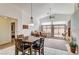 Dining room has large windows, ceiling fan, and access to living room at 5419 Sharpei Ct, Las Vegas, NV 89131