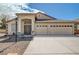 Inviting single-story home with a well-maintained front yard and a spacious three-car garage at 5419 Sharpei Ct, Las Vegas, NV 89131
